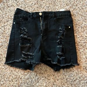 Women’s black distressed shorts